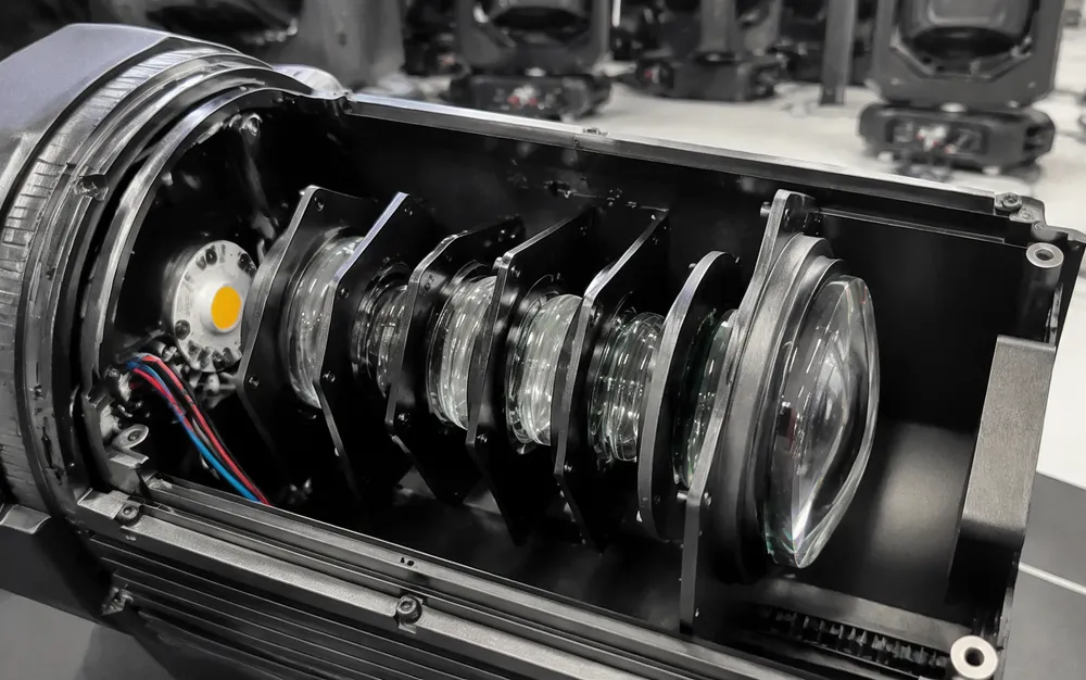 Multi-element glass lens assembly inside Vefey professional church stage lighting fixture showing optical path engineering