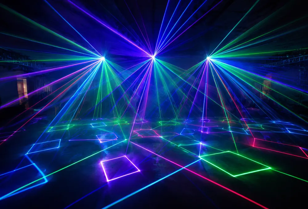 Vefey disco laser light fixture showing galvo-scanned beam effects in a dark venue with aerial haze patterns
