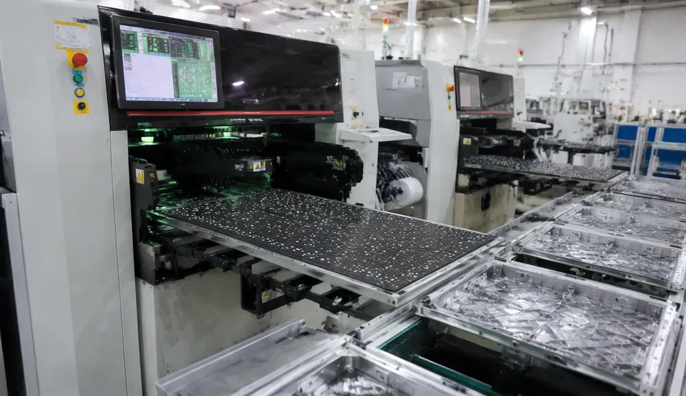 Vefey automated SMT production line placing LED chips on backdrop panel PCBs with die-cast aluminum frames visible on assembly conveyor