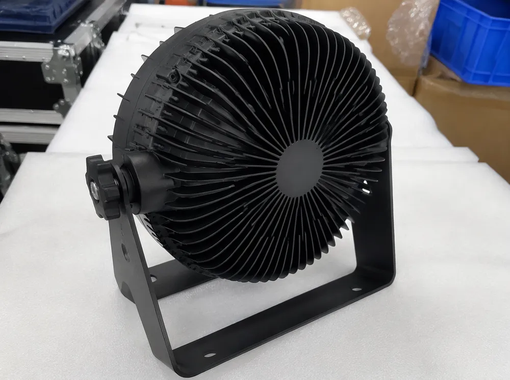 Oversized aluminum heatsink assembly in dance stage lighting fixture showing thermal mass engineering